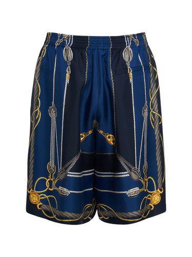 Shorts In Seta Stampata - VERSACE - Modalova