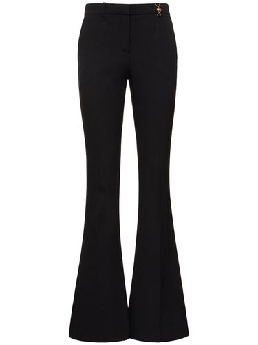 Wool Crepe Mid Rise Flared Pants - VERSACE - Modalova