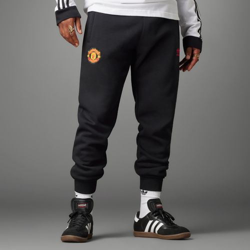 Pantalón Essentials Trefoil Manchester United - adidas - Modalova
