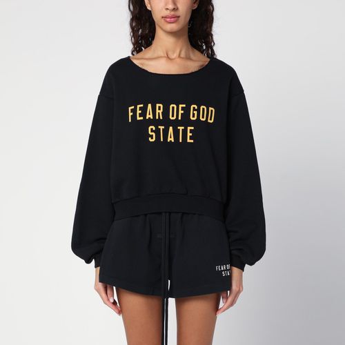 Felpa cropped nera con logo - Fear of God Essentials - Modalova