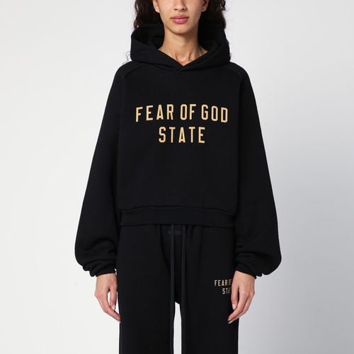 Felpa cropped nera con logo - Fear of God Essentials - Modalova