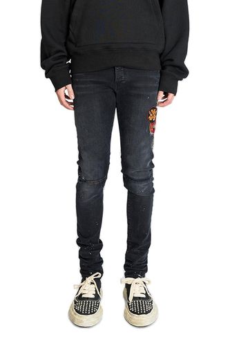 Logo Patch Distressed Skinny Jeans - AMIRI - Modalova