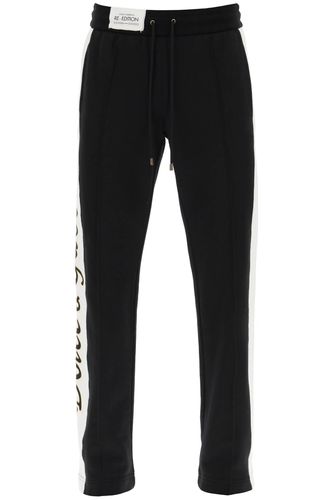 Jogger Pants With Lettering Logo Patch - Dolce & Gabbana - Modalova
