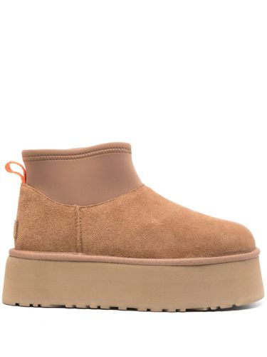 Woman Classic Mini Dipper Puffer Boots - UGG - Modalova