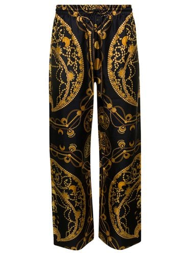 Loose Pants With All-over Graphic Print In Silk Man - Marine Serre - Modalova