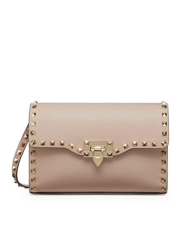 SMALL ROCKSTUD CROSSBODY BAG IN GARNET CALFSKIN - Woman - Valentino Garavani - Modalova