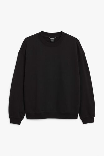 Schwarzer Pullover mit Rundhalsausschnitt Schwarz, Sweatshirts in Größe XXS. Farbe: - Monki - Modalova