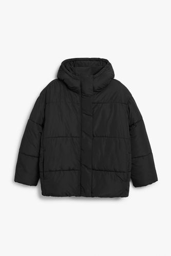 Wattierte Oversize-Jacke mit Kapuze Schwarz, Jacken in Größe XS. Farbe: - Monki - Modalova