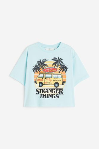 Oversized T-Shirt mit Print Hellblau/Stranger Things, T-Shirts & Tops in Größe 146/152. Farbe: - H&M - Modalova