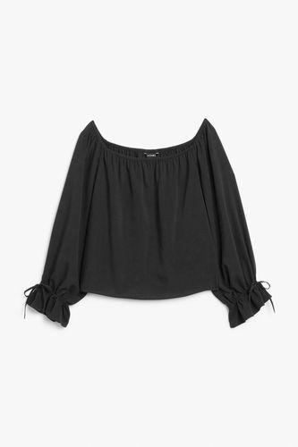 Schulterfreie Bluse mit langen Ärmeln Schwarz/Grün, Blusen in Größe XL. Farbe: - Monki - Modalova