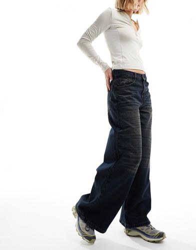 X013 - Jeans a fondo ampio a vita medio alta lavaggio scuro - Collusion - Modalova