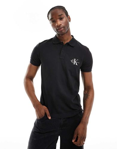 Polo nera con logo - Calvin Klein Jeans - Modalova