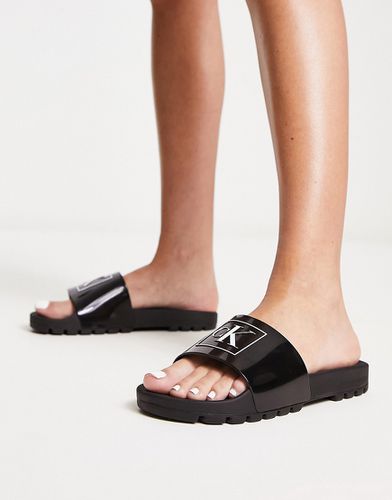 Sliders nere di gomma con logo - Calvin Klein Jeans - Modalova