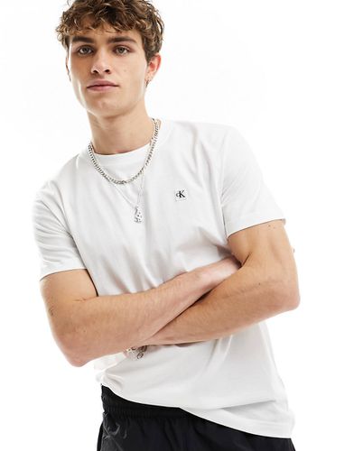 T-shirt bianca con stemma ricamato - Calvin Klein Jeans - Modalova