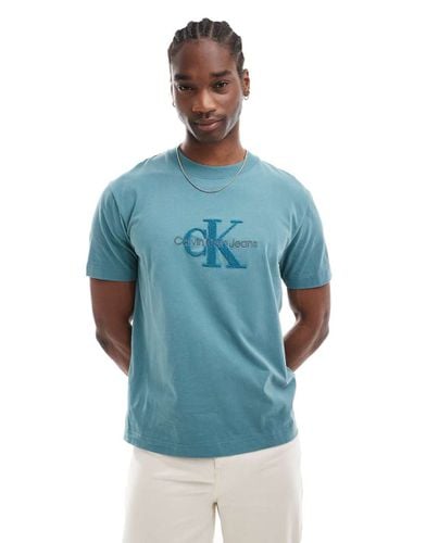 T-shirt turchese con monogramma del logo in ciniglia - Calvin Klein Jeans - Modalova