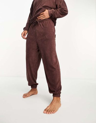 Joggers da casa in spugna color bordeaux profondo - Calvin Klein - Modalova