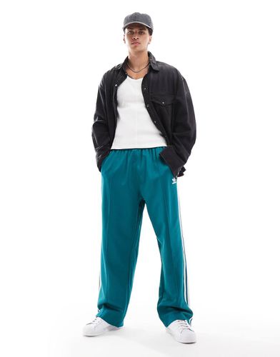 Adicolor - Pantaloni della tuta oversize verde-azzurro - adidas Originals - Modalova