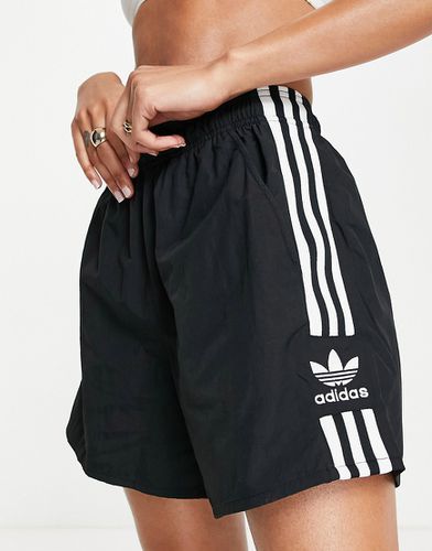 Pantaloncini oversize neri con tre strisce - adidas Originals - Modalova