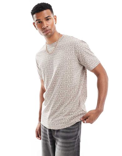 T-shirt squadrata beige con scritta stampata - Armani Exchange - Modalova