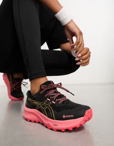 Running Trabuco 11 GTX - Sneakers impermeabili nere e rosa con suola a contrasto - Asics - Modalova