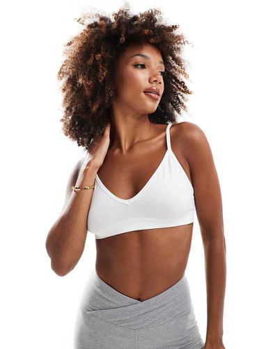 Icon - Reggiseno sportivo a supporto leggero senza cuciture - ASOS - Modalova