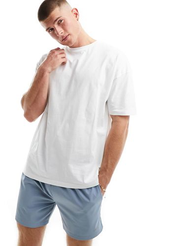 Icon - T-shirt da allenamento oversize bianca ad asciugatura rapida con logo - ASOS - Modalova