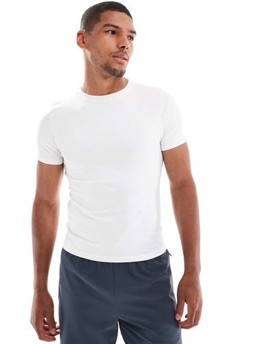 T-shirt da allenamento slim senza cuciture bianca - ASOS - Modalova