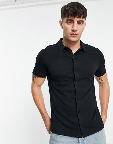 Camicia in jersey attillata nera - ASOS DESIGN - Modalova