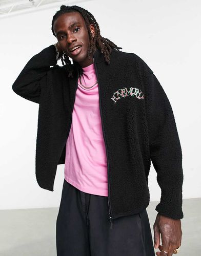 Giacca sportiva oversize in pile borg nera con zip e logo sul petto - ASOS DESIGN - Modalova