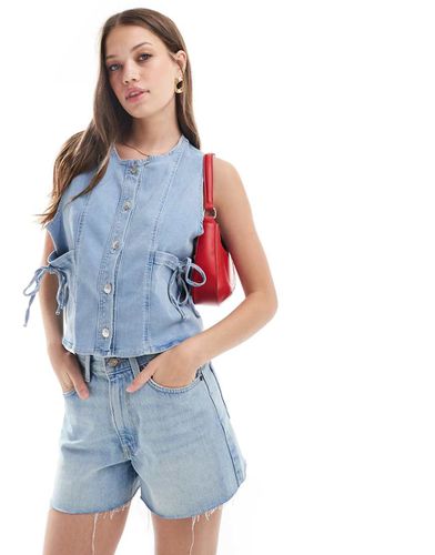 Gilet in denim candeggiato con fiocchi - ASOS DESIGN - Modalova