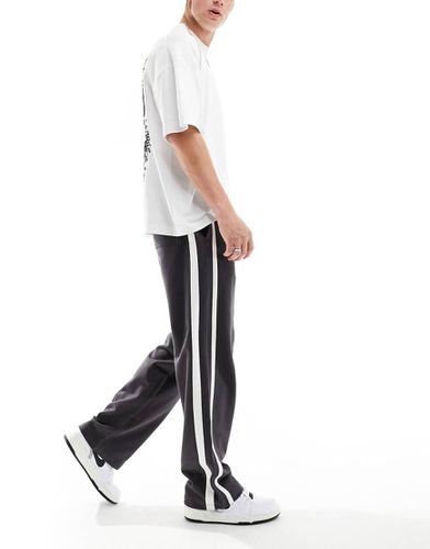 Joggers a fondo ampio neri con fettucce - ASOS DESIGN - Modalova