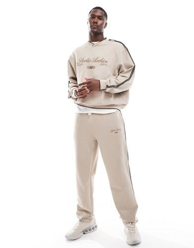 Joggers a fondo ampio beige con fettuccia - ASOS DESIGN - Modalova