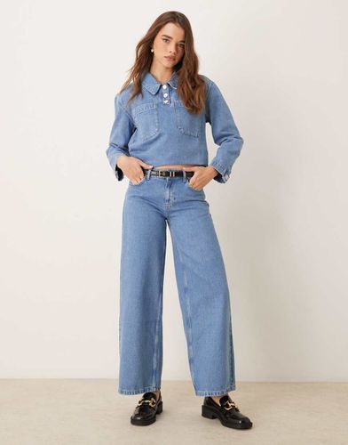 Jeans a vita bassa ampi medio - ASOS DESIGN - Modalova