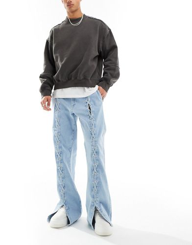 Jeans a zampa ampi lavaggio chiaro con slacci - ASOS DESIGN - Modalova