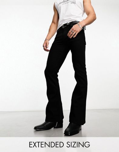 Jeans a zampa neri elasticizzati - ASOS DESIGN - Modalova