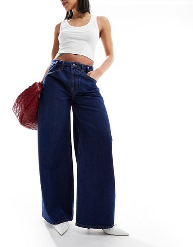 Jeans a fondo ampio con vita regolabile rinse - ASOS DESIGN - Modalova