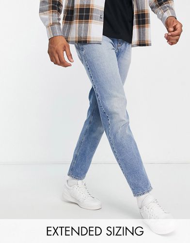 Jeans affusolati lavaggio medio slavato - ASOS DESIGN - Modalova