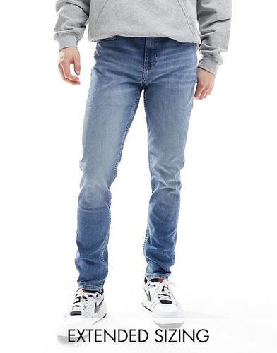 Jeans skinny con lavaggio chiaro vintage - ASOS DESIGN - Modalova