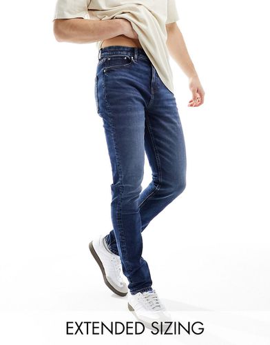 Jeans skinny lavaggio scuro vintage - ASOS DESIGN - Modalova