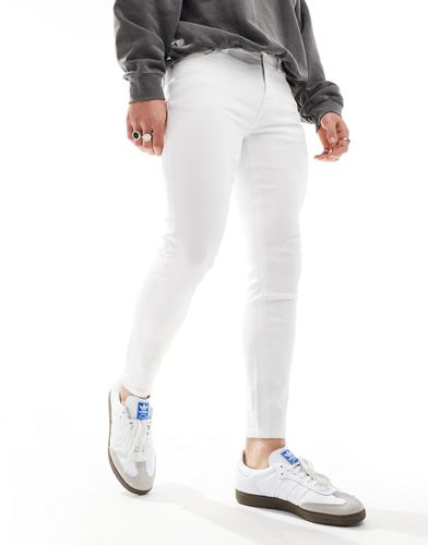 Jeans spray on super elasticizzati bianchi - ASOS DESIGN - Modalova