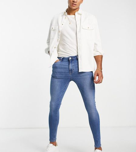 Jeans spray on power stretch lavaggio classico - ASOS DESIGN - Modalova