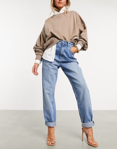 Mom jeans vita alta larghi lavaggio medio - ASOS DESIGN - Modalova