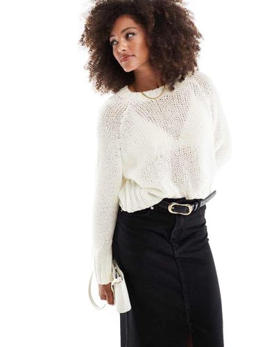 Maglione girocollo crema bouclé a maglia larghe - ASOS DESIGN - Modalova