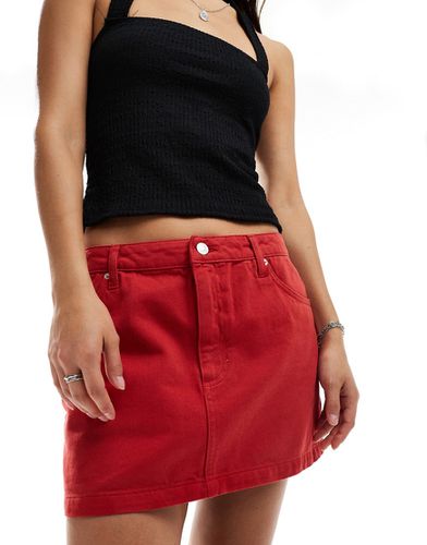 Minigonna di jeans rossa - ASOS DESIGN - Modalova