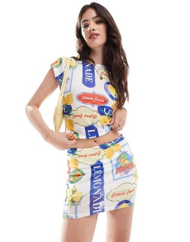 Minigonna in rete con stampa di frutta in coordinato - ASOS DESIGN - Modalova