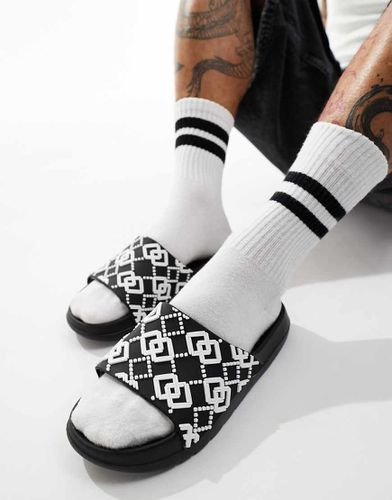 Sliders nere con monogrammi e suola spessa - ASOS DESIGN - Modalova