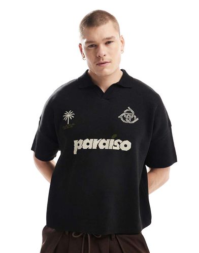 Polo oversize squadrata in maglia nera con stampa "Paraiso" sul petto - ASOS DESIGN - Modalova