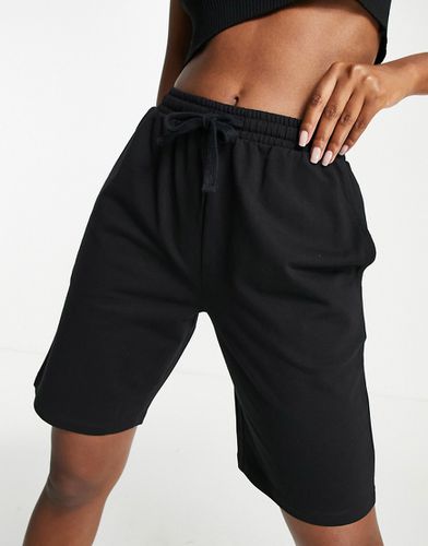 Pantaloncini della tuta neri in cotone a vita medio alta anni '90 taglio lungo - ASOS DESIGN - Modalova