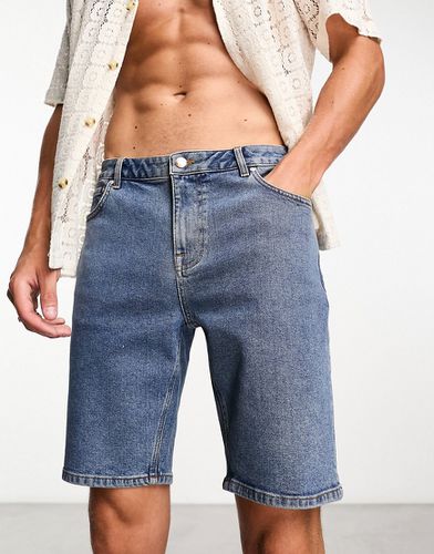 Pantaloncini di jeans skinny lunghezza normale lavaggio medio piatto - ASOS DESIGN - Modalova