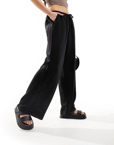 Pantaloni a fondo ampio neri in misto lino - ASOS DESIGN - Modalova